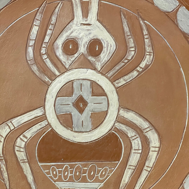 Cherokee pottery plate by Victoria M. Vazquez. Spider who Carried First Fire design