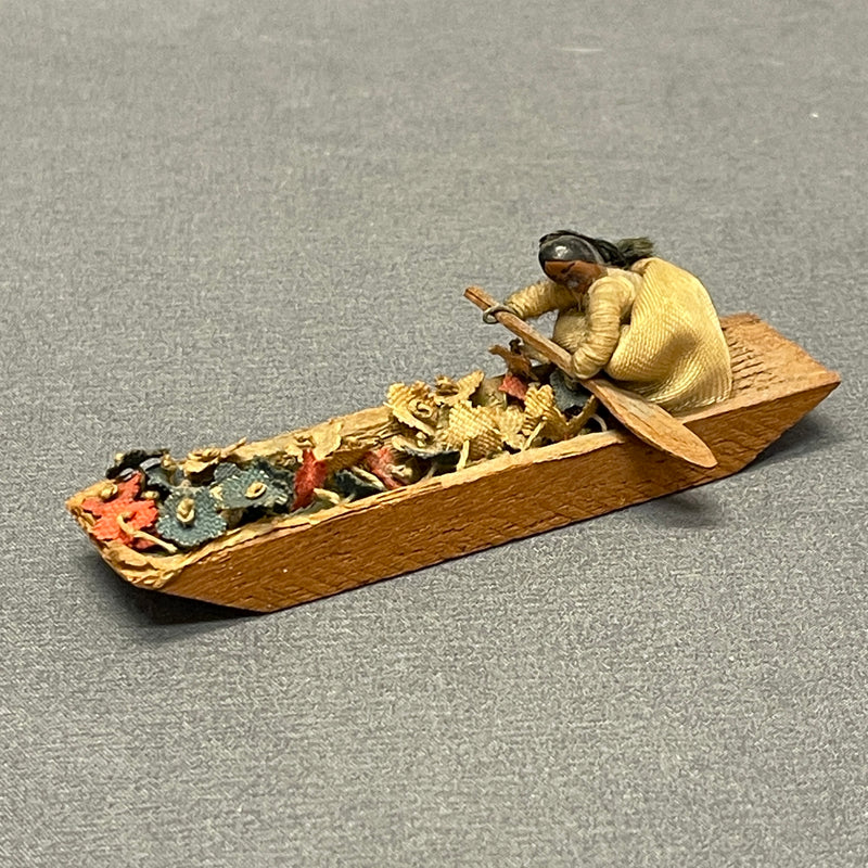 Miniature Native American woman paddling dugout canoe with fabric flowers  (SSC37)
