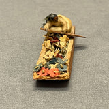 Miniature Native American woman paddling dugout canoe with fabric flowers  (SSC37)