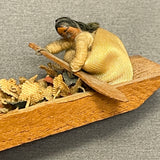 Miniature Native American woman paddling dugout canoe with fabric flowers  (SSC37)