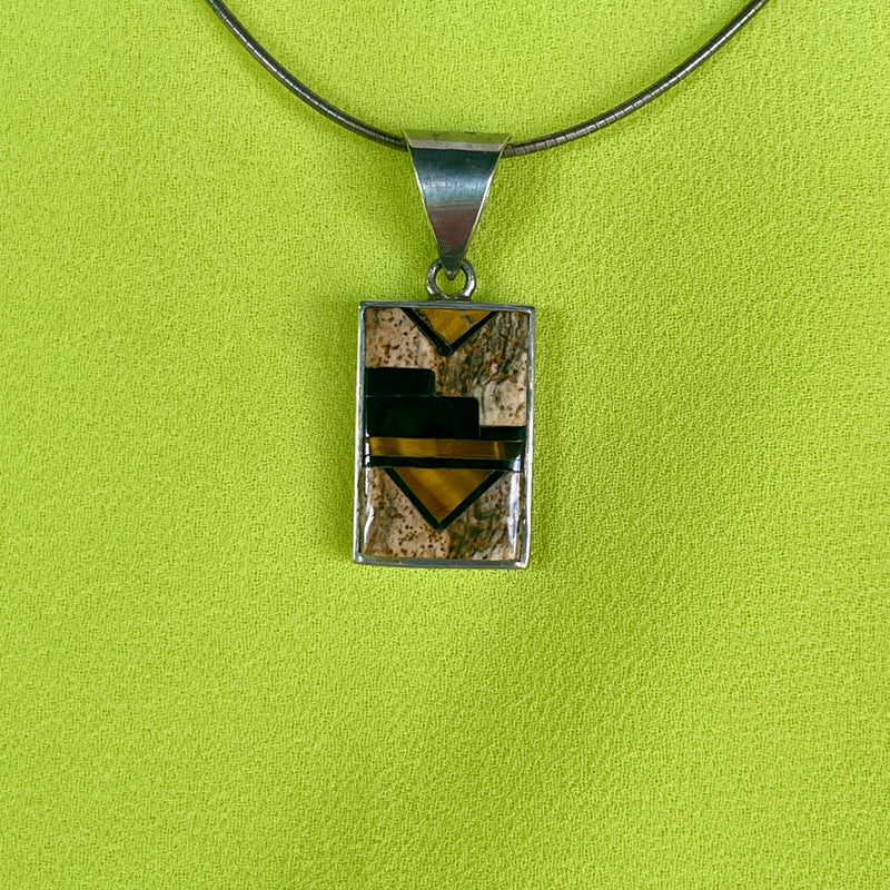 Navajo inlay pendant with black jet, picture jasper and tiger eye/ Reversible with dancer on other side - Made by Supersmith (PZ12)