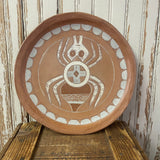 Cherokee pottery plate by Victoria M. Vazquez. Spider who Carried First Fire design