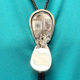 Turquoise bolo tie with hinge revealing a hand-cut Navajo scene (JF116)