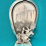 Turquoise bolo tie with hinge revealing a hand-cut Navajo scene (JF116)