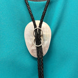 Turquoise bolo tie with hinge revealing a hand-cut Navajo scene (JF116)