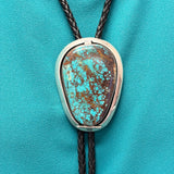 Turquoise bolo tie with hinge revealing a hand-cut Navajo scene (JF116)